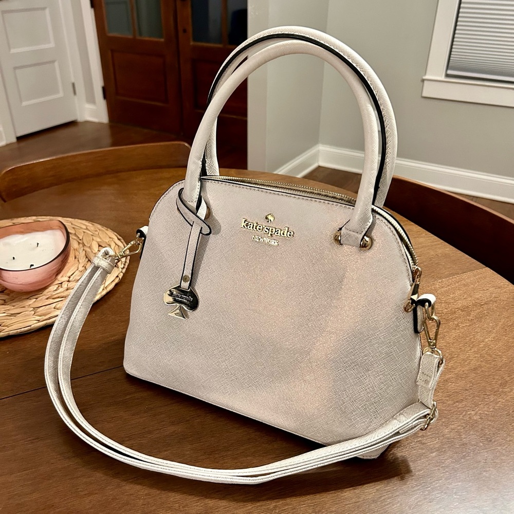 Kate Space Handbag in cream with gold iridescent finish.